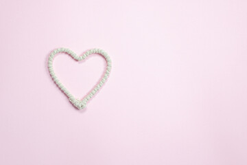 Rope heart  on a pink background