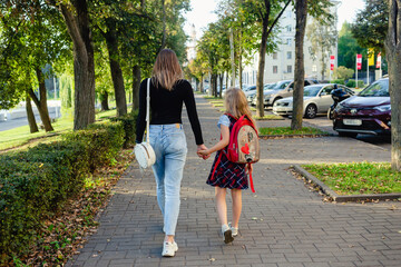 preschool girl walk with her mother