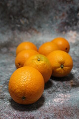 fresh oranges lying on the counter, fresh fruit stacked, orange
