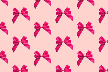 Pink bows pattern on pink background. Gift wrapping