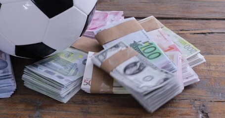 soccer ball in the money banknote - Powered by Adobe