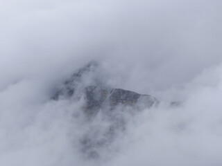 Wetterstein Mountains, Zugspitz Region In Tyrol, A Small Part Of Rock Faces Surrounded By Clouds