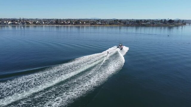 Drone shot of a wakeboarder in the bay.