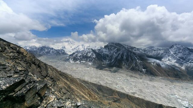 Timelapse from the Gokyo Ri of the mountains and clouds above. From the Gokyo Ri summit it is possible to see four 8,000-metre peaks: Mount Everest, Lhotse, Makalu and Cho Oyu. Himalaya, Nepal