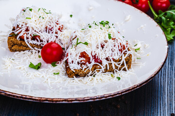 Healthy toasts with rye bread with tomato, cheese on white plate.