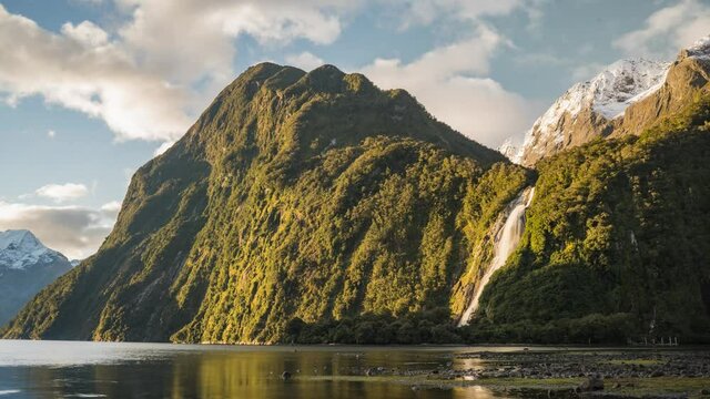 Timelapse of a waterfall in fjords surrounded by mountains - Bowen Falls, Miflord Sound