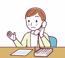 Young woman in a cardigan_Fixed-line phone