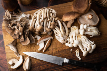 mushrooms on wooden board, oyster mushroom, shimeji, shitake