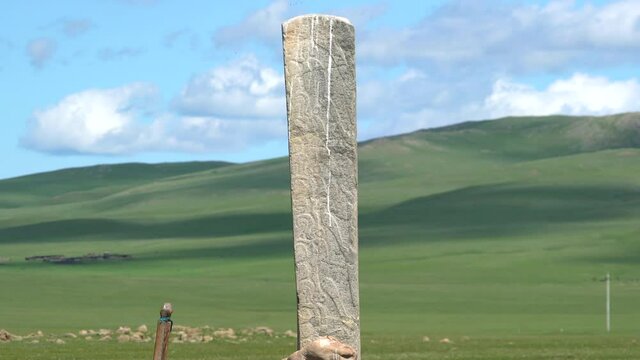 Inscription of obelisk menhir from old ancient times.Deer stone is megalith carved with symbols.Deerstone cemeteries orthostat stele steppe history historical antique petroglyph monuments memorial 4K