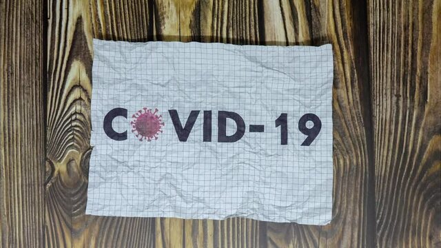 covid 19 corona virus word art on wood texture wallpaper stop motion