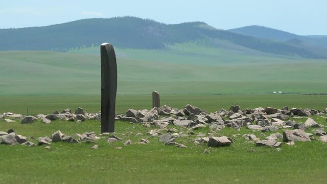 Inscription of obelisk menhir from old ancient times.Deer stone is megalith carved with symbols.Deerstone cemeteries orthostat stele steppe history historical antique petroglyph monuments memorial 4K