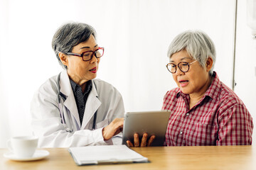 Doctor consulting and check up information with senior woman in hospital.elderly woman has sick.healthcare and medicine