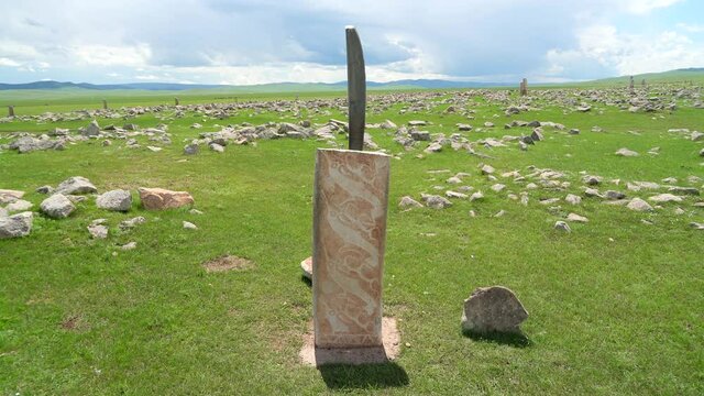 Inscription of obelisk menhir from old ancient times.Deer stone is megalith carved with symbols.Deerstone cemeteries orthostat stele steppe history historical antique petroglyph monuments memorial 4K