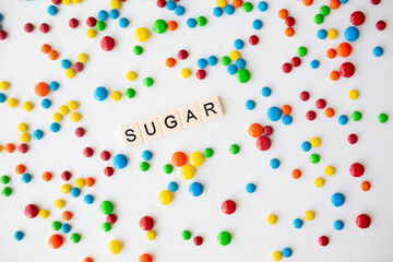 cheerful flat lay white backdrop scene surrounded by rainbow candies