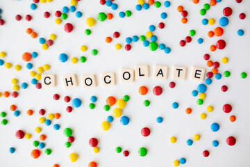 cheerful flat lay white backdrop scene surrounded by rainbow candies