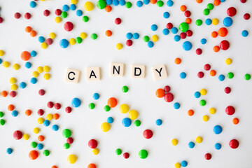 Obraz premium cheerful flat lay white backdrop scene surrounded by rainbow candies