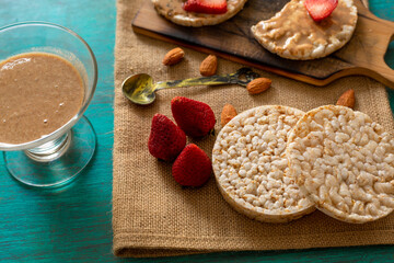 rice crackers, whit fruits on table blue
