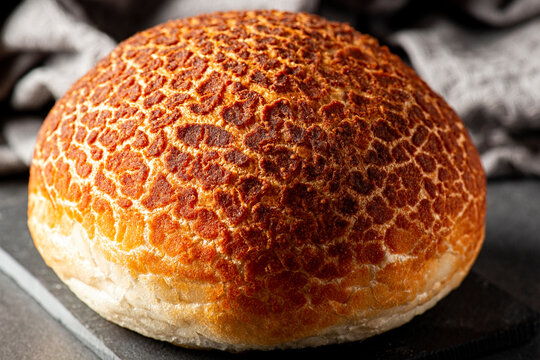 Fresh baked Tiger Bread roll also known as Dutch Crunch.