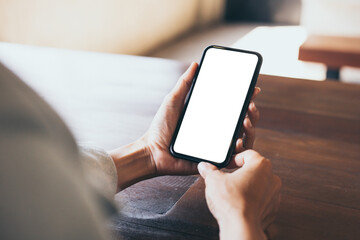 cell phone blank white screen mockup.woman hand holding texting using mobile on desk at office.background empty space for advertise.work people contact marketing business,technology