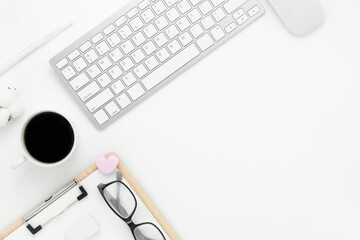 Minimal Office desk table top view with office supply and coffee cup on a white table with copy space, White color workplace composition, flat lay