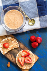 rice crackers, whit fruits on table blue
