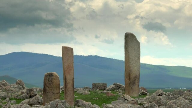 Deer stones are ancient megaliths carved with symbols. Grave deerstone deerstones funerary or commemorative purposes. Kurgan stelae kurgans historical antique menhir standing orthostat old 4K