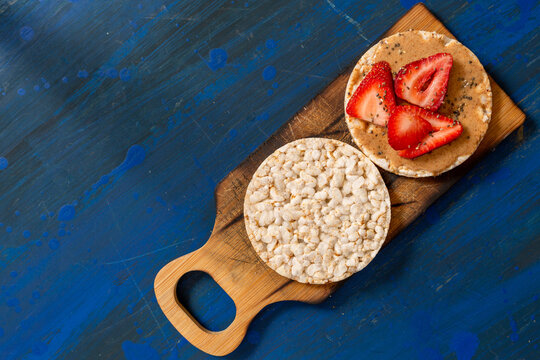 rice crackers, whit fruits on table blue
