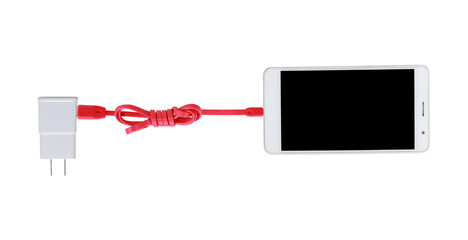 Smartphone charging with adapter power plug on white background with clipping path