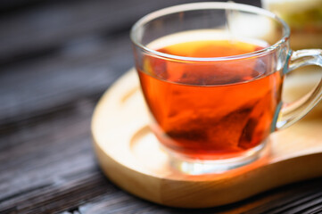 Hot Tea with Tuna Sandwich on wooden plate