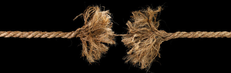 Long rope, frayed and ready to break apart, held together by a last strand ready to snap. Concept of dangerous stress or stressful situation like divorce separation, deadlines, failure, or tension.