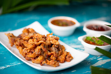 Crispy fried sliced belly pork with spicy sauce