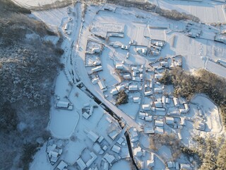The roofs of rural villages covered with white snow