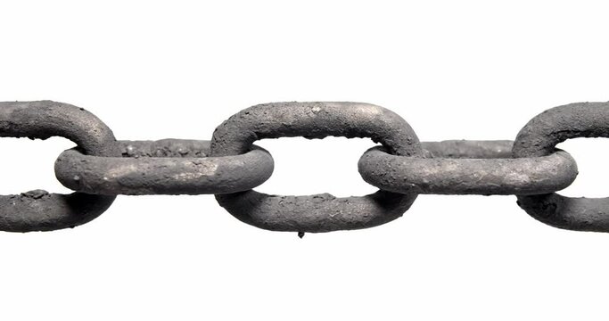 Slow panning across an old rusty chain showing each link pulled taut. Concept of strength, security, or strong connection.