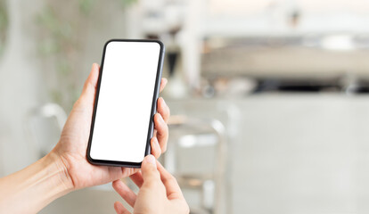 cell phone blank white screen mockup.woman hand holding texting using mobile on desk at office.background empty space for advertise.work people contact marketing business,technology