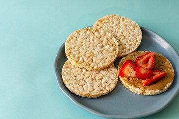 rice crackers, whit fruits on table blue
