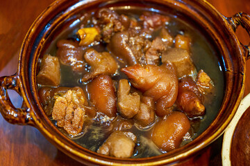 One pot of delicious Chinese food, sweet and sour pork knuckle ginger