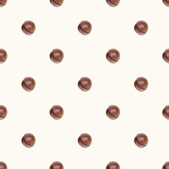 Brown round macadamia nuts seamless pattern on light background.