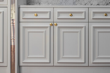 Close-up texture of white wood cabinets in house