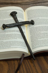 3 Nails Cross on an Open Bible