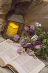 Purple Flowers and Lantern, with an Open Bible