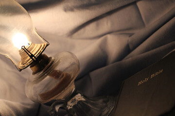 Lamp Beside a Closed Bible