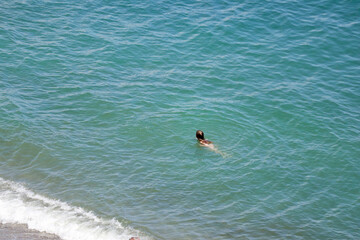 Person swimming in the sea