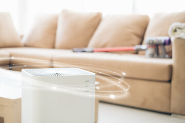 air purifier a living room,  air cleaner removing fine dust in house. protect PM 2.5 dust and air pollution concept
