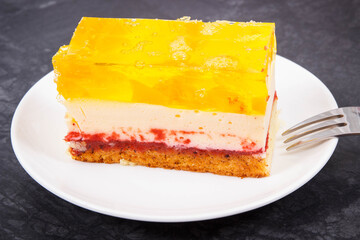 Creamy sweet sponge cake with different layers and jelly. Dessert for celebrations
