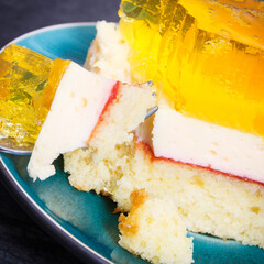 Creamy sweet sponge cake with layers and jelly. Festive dessert