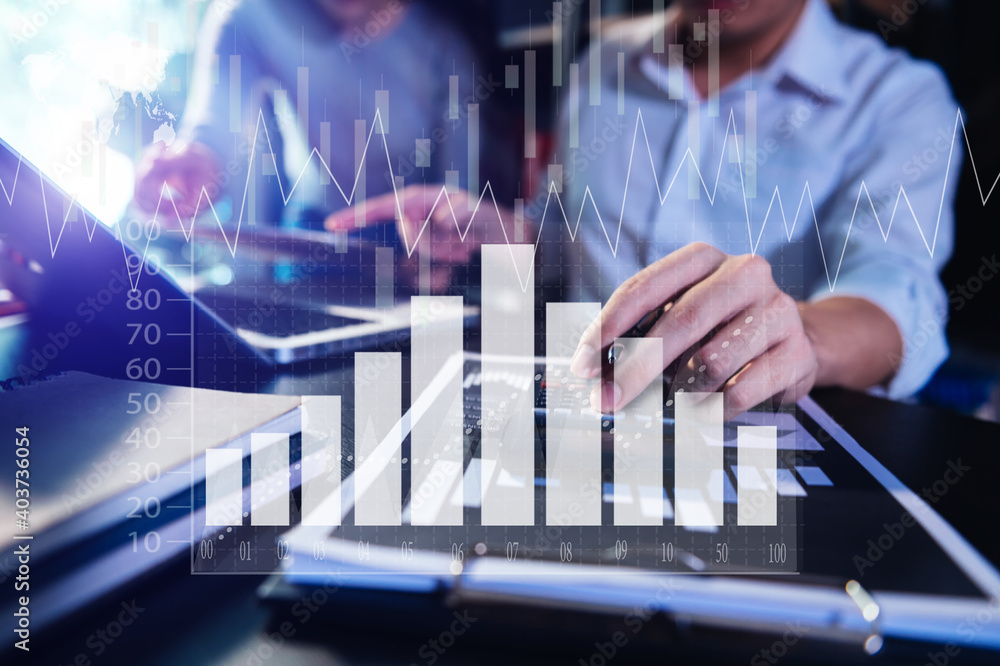 Wall mural Business documents on office table with smart phone and calculator digital tablet and graph business with social network diagram and two colleagues discussing data working.