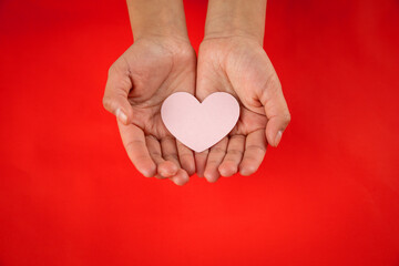Fototapeta premium hands holding hearts, valentine's day concept