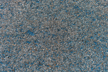 Solid stone background with fine texture and inclusions. Abstract blank for design