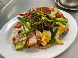 Plate of delicious Chinese style chopped chicken and pork belly 