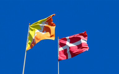 Flags of Denmark and Bhutan.